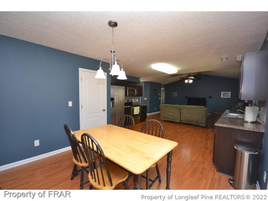 804 Loop Road Raeford, NC 28376 - Photo 12 of 26 a view of a dining room with furniture