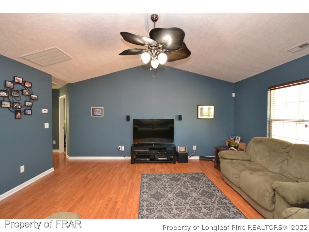 804 Loop Road Raeford, NC 28376 - Photo 4 of 26 a living room with furniture and a flat screen tv