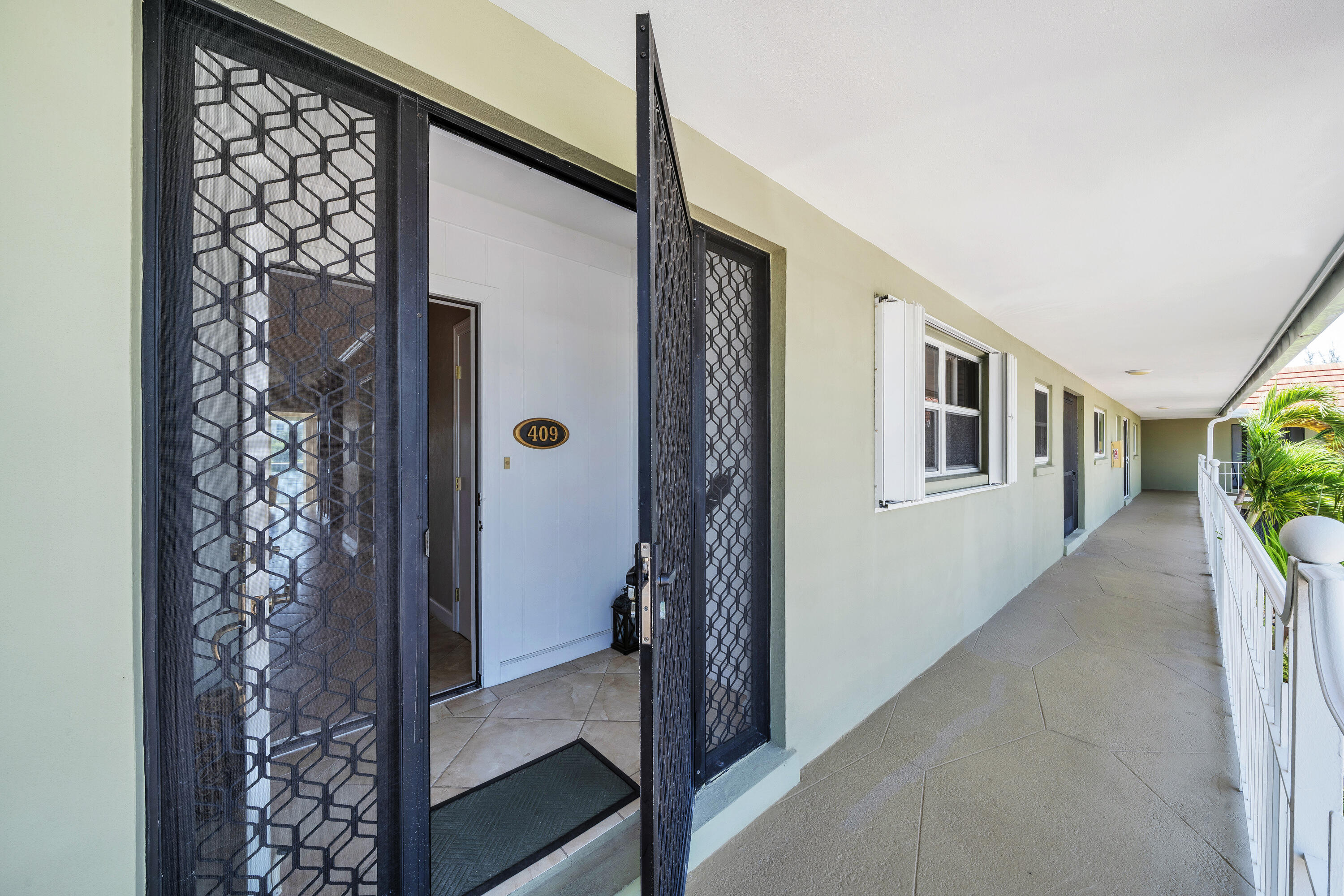711 Northeast Harbour Terrace, Unit 409 Boca Raton, FL 33431 - Photo 35 of 42 Screened front porch