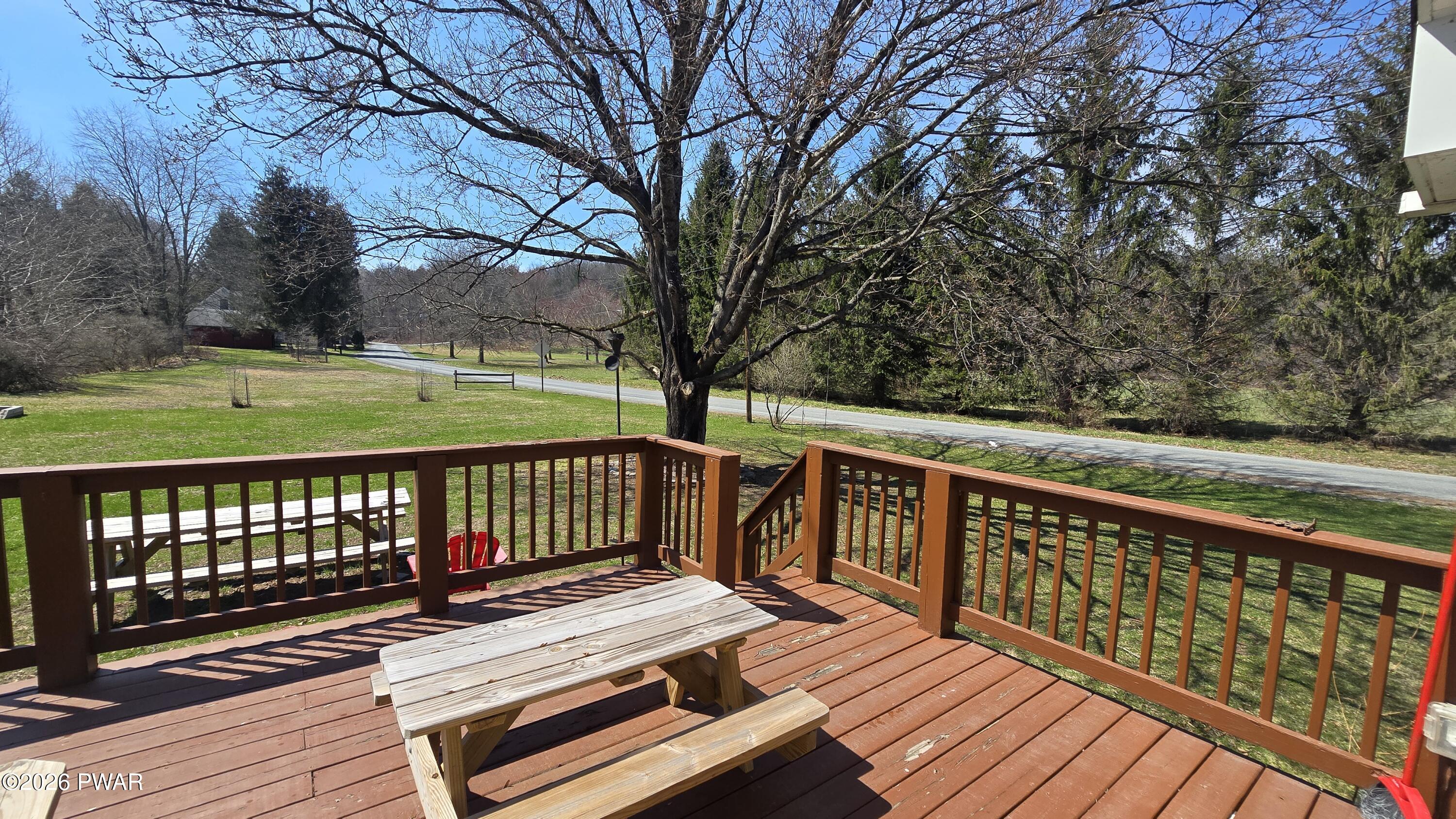 430 Griffith Road Tyler Hill, PA 18469 - Photo 29 of 31 a view of a wooden deck with a yard