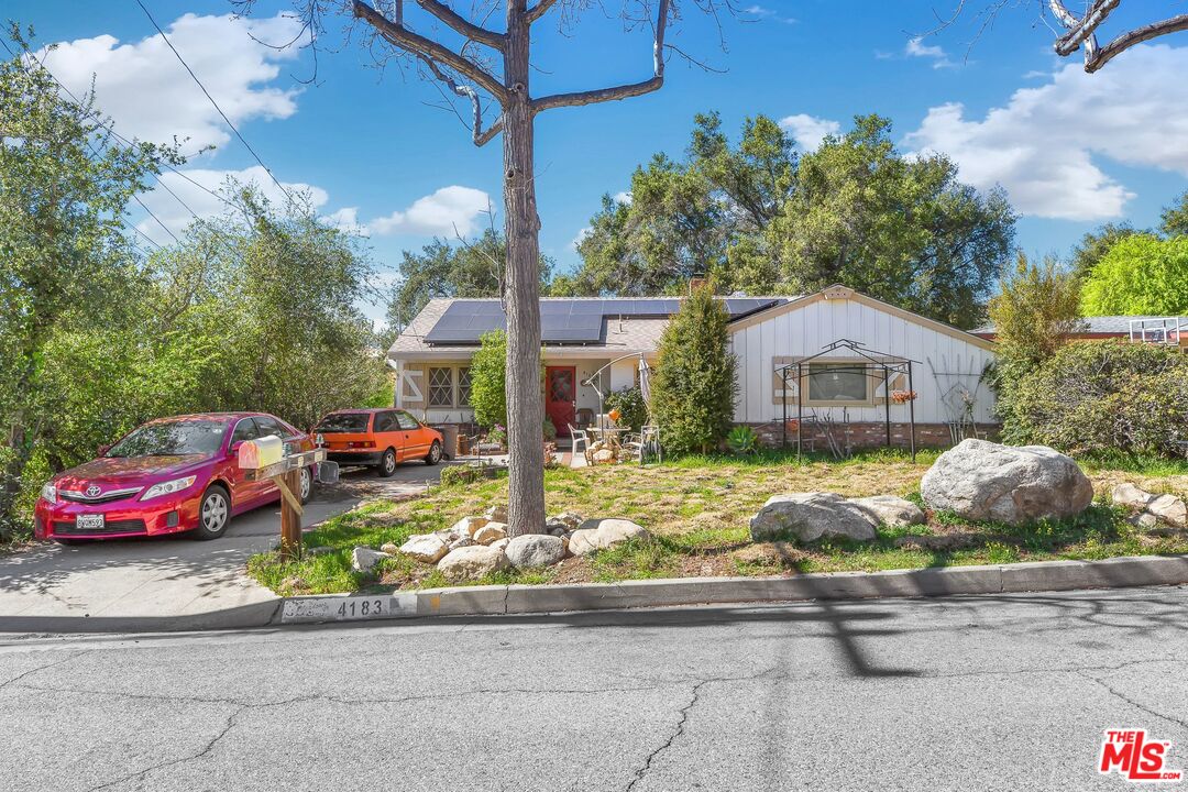 4183 Aralia Road Altadena, CA 91001 - Photo 1 of 40 a front view of a house with garden
