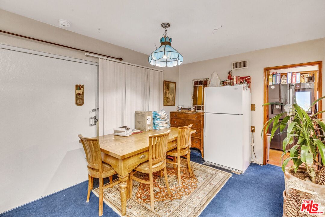 4183 Aralia Road Altadena, CA 91001 - Photo 11 of 40 a view of a dining room with furniture window and wooden floor