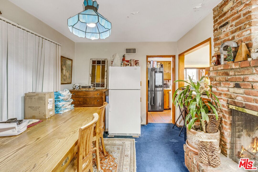 4183 Aralia Road Altadena, CA 91001 - Photo 12 of 40 a kitchen with stainless steel appliances granite countertop a refrigerator a microwave oven a sink and dishwasher