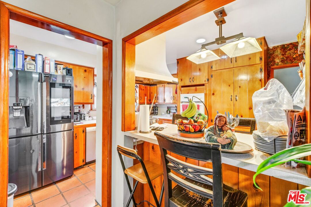 4183 Aralia Road Altadena, CA 91001 - Photo 17 of 40 a view of a kitchen with furniture and a window