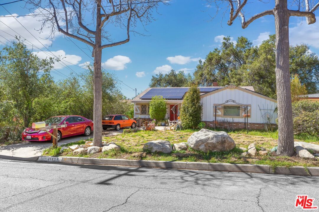 4183 Aralia Road Altadena, CA 91001 - Photo 2 of 40 a front view of a house with garden