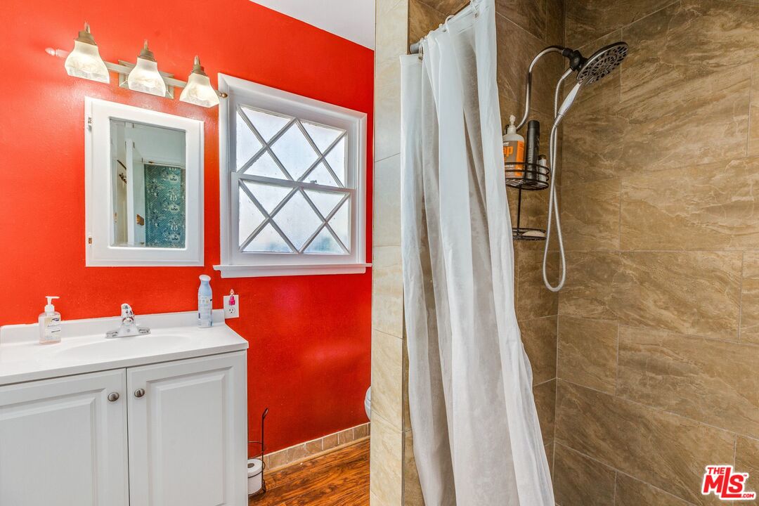 4183 Aralia Road Altadena, CA 91001 - Photo 25 of 40 a bathroom with a sink and a mirror