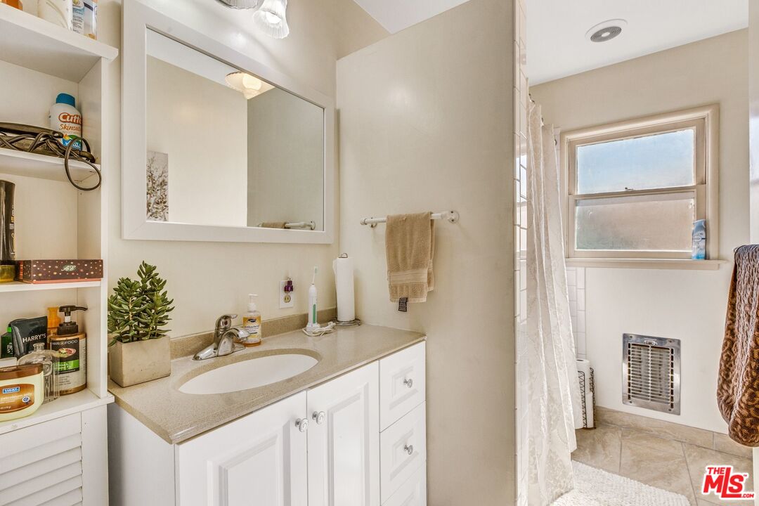 4183 Aralia Road Altadena, CA 91001 - Photo 27 of 40 a bathroom with a sink and a mirror