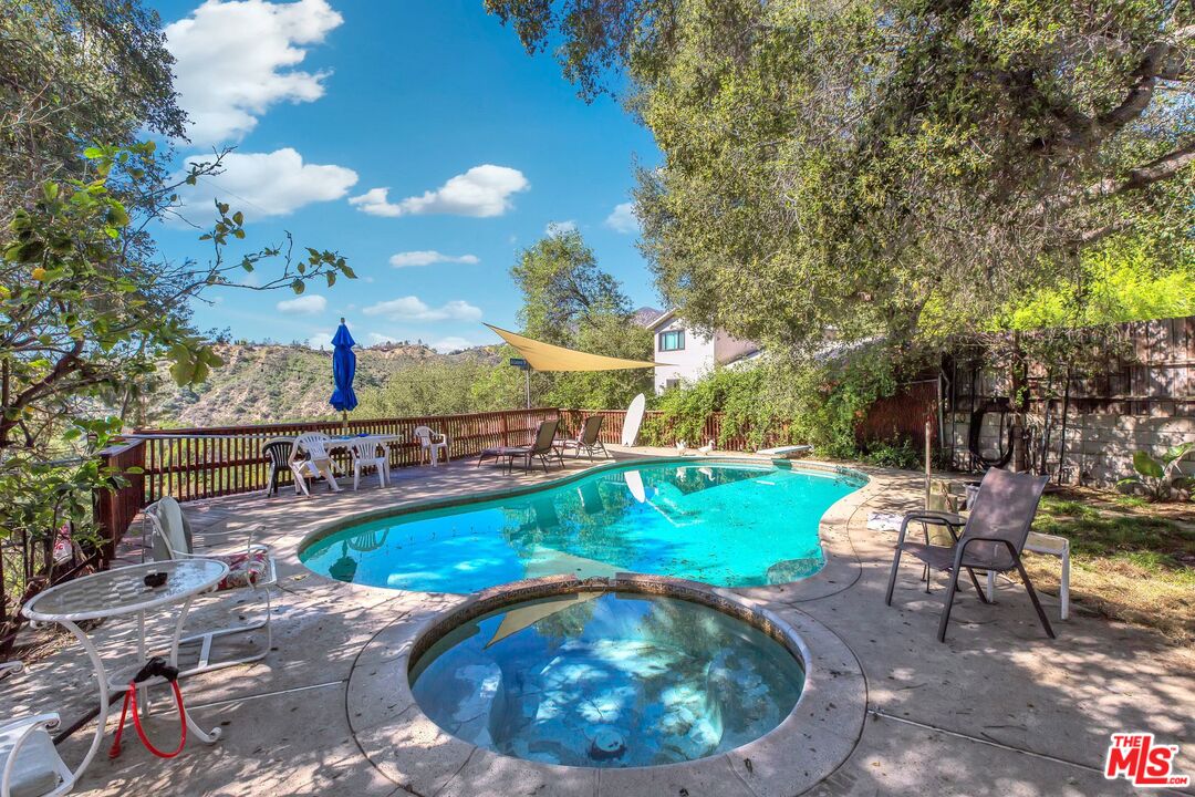 4183 Aralia Road Altadena, CA 91001 - Photo 33 of 40 a view of a swimming pool with a patio