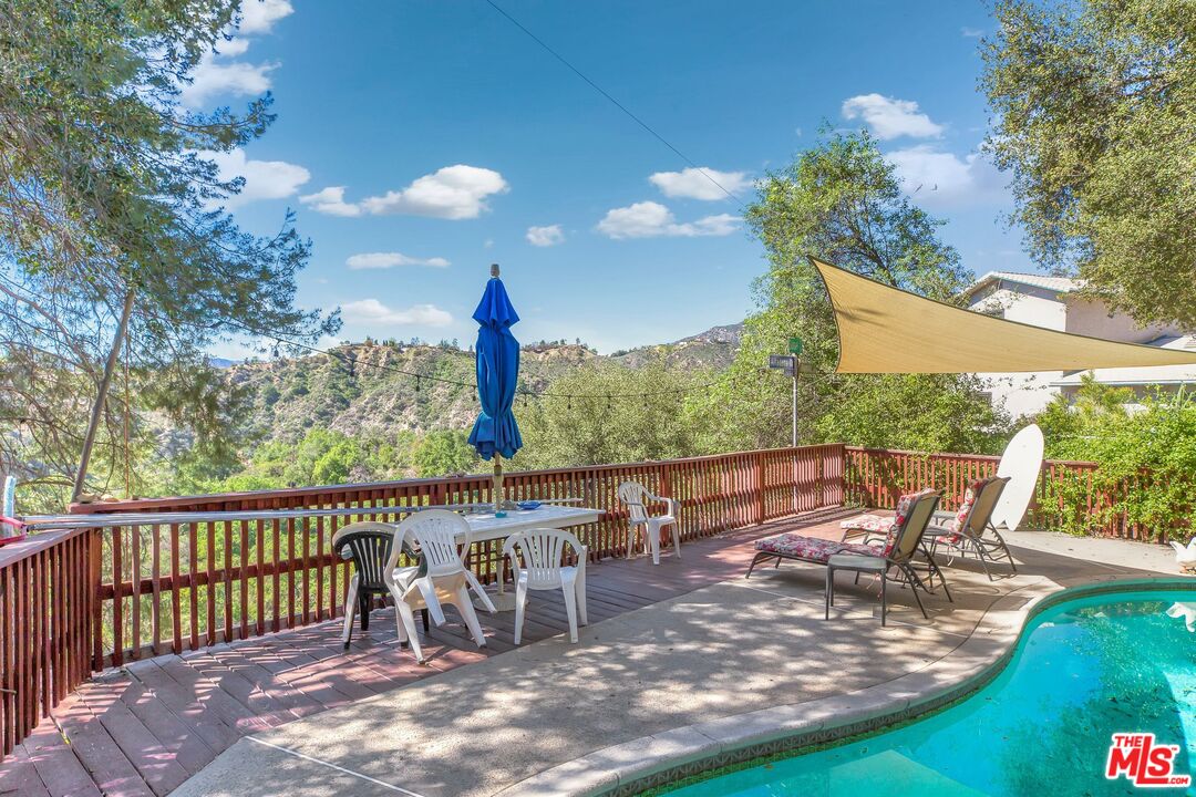 4183 Aralia Road Altadena, CA 91001 - Photo 40 of 40 a view of a patio with a table chairs and a backyard