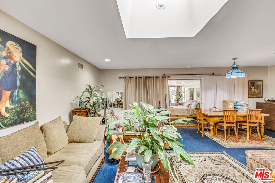 4183 Aralia Road Altadena, CA 91001 - Photo 7 of 40 a living room with lots of furniture and a wooden floor