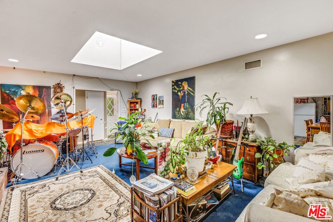 4183 Aralia Road Altadena, CA 91001 - Photo 10 of 40 a living room with lots of furniture and wooden floor