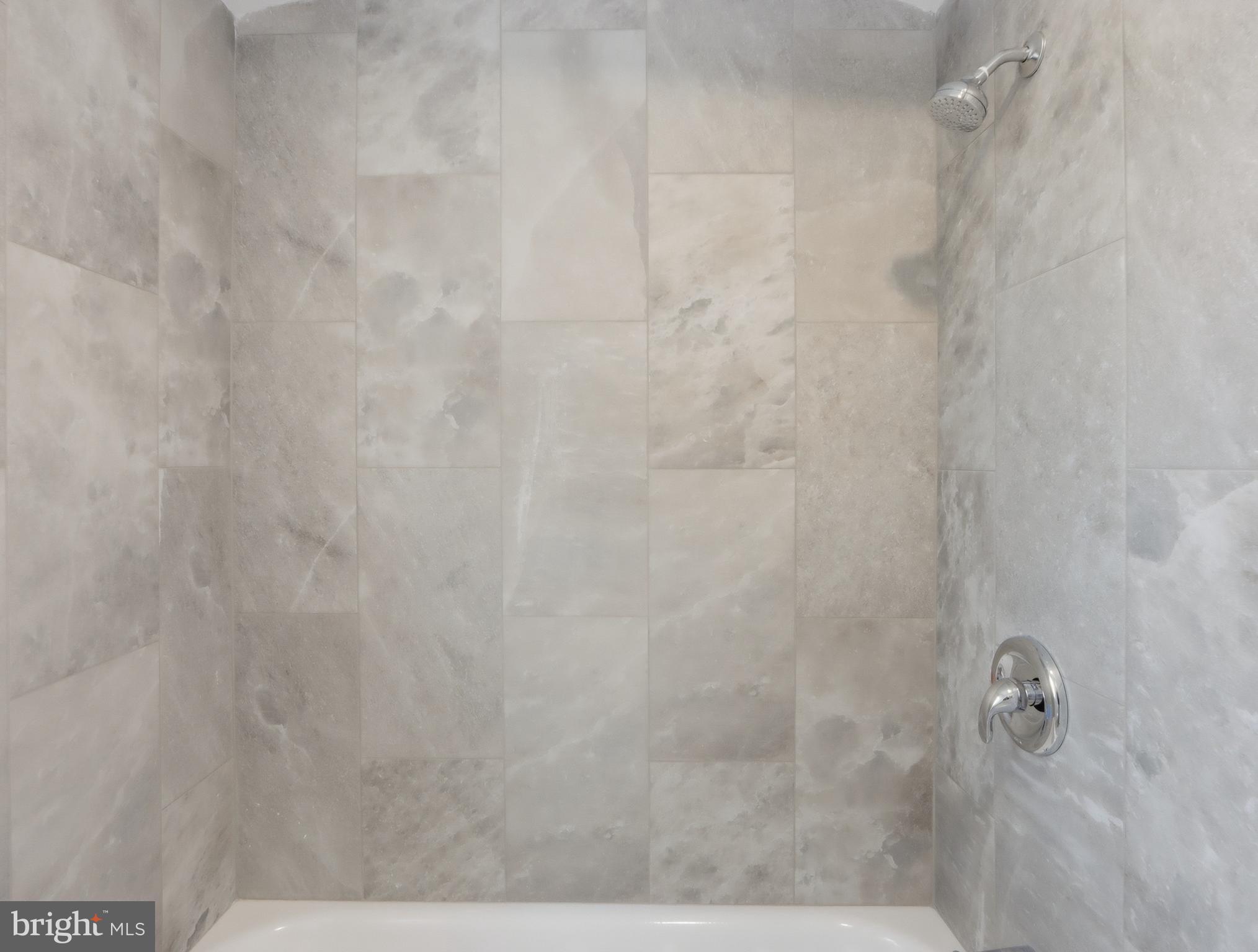 932 East 41st Street Baltimore, MD 21218 - Photo 27 of 51 a bathroom with a shower