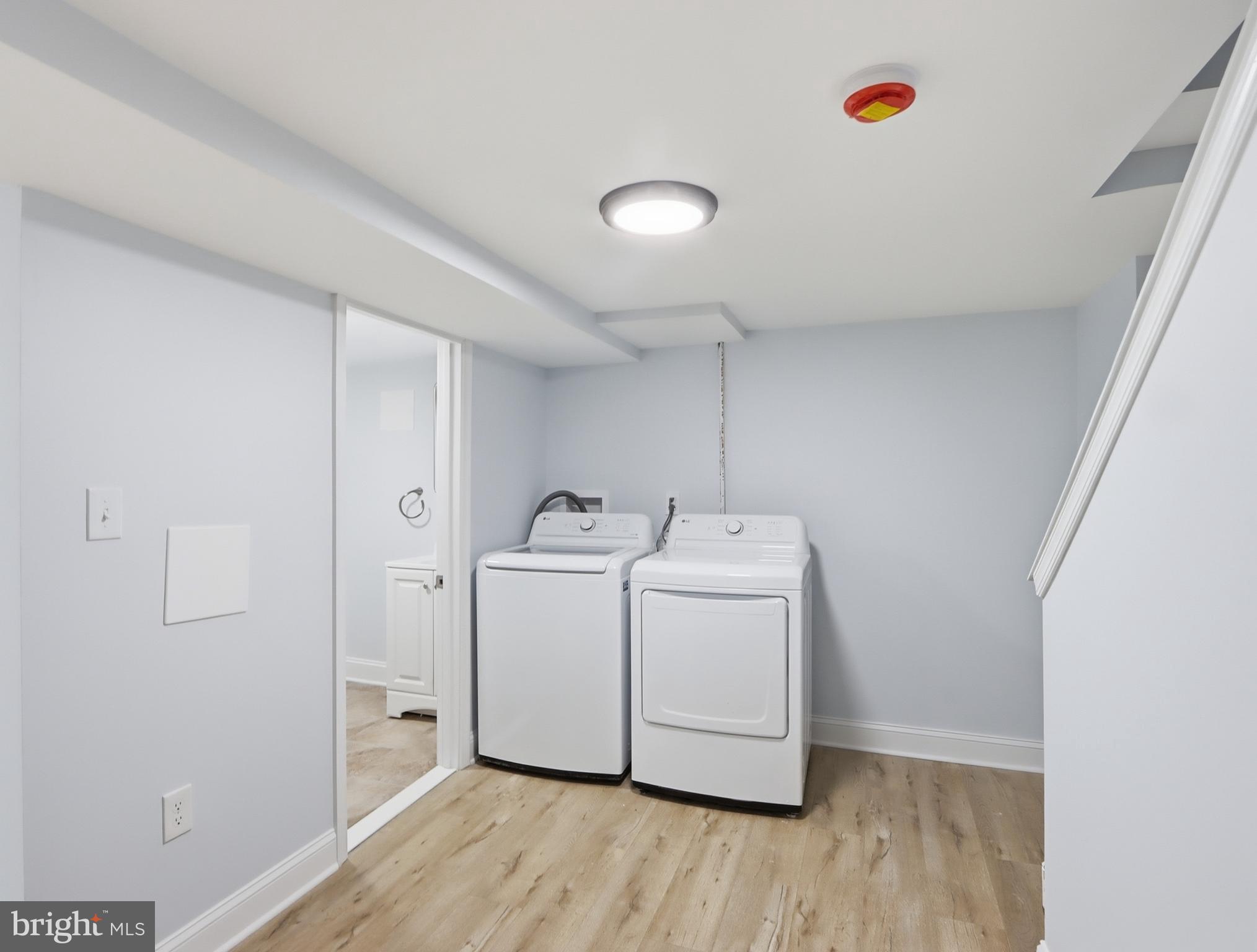932 East 41st Street Baltimore, MD 21218 - Photo 35 of 51 a utility room with dryer and washer