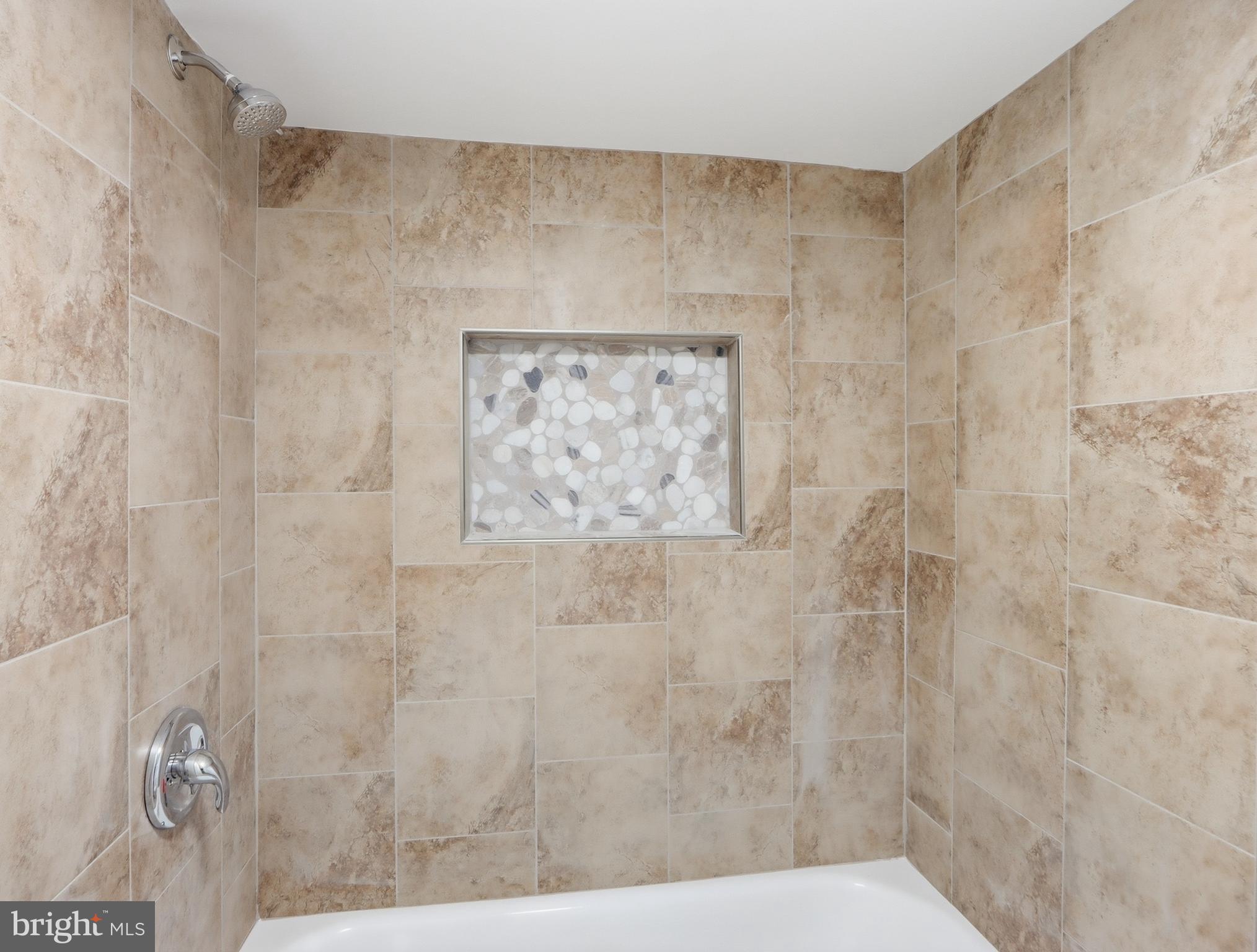 932 East 41st Street Baltimore, MD 21218 - Photo 38 of 51 a bathroom with a shower