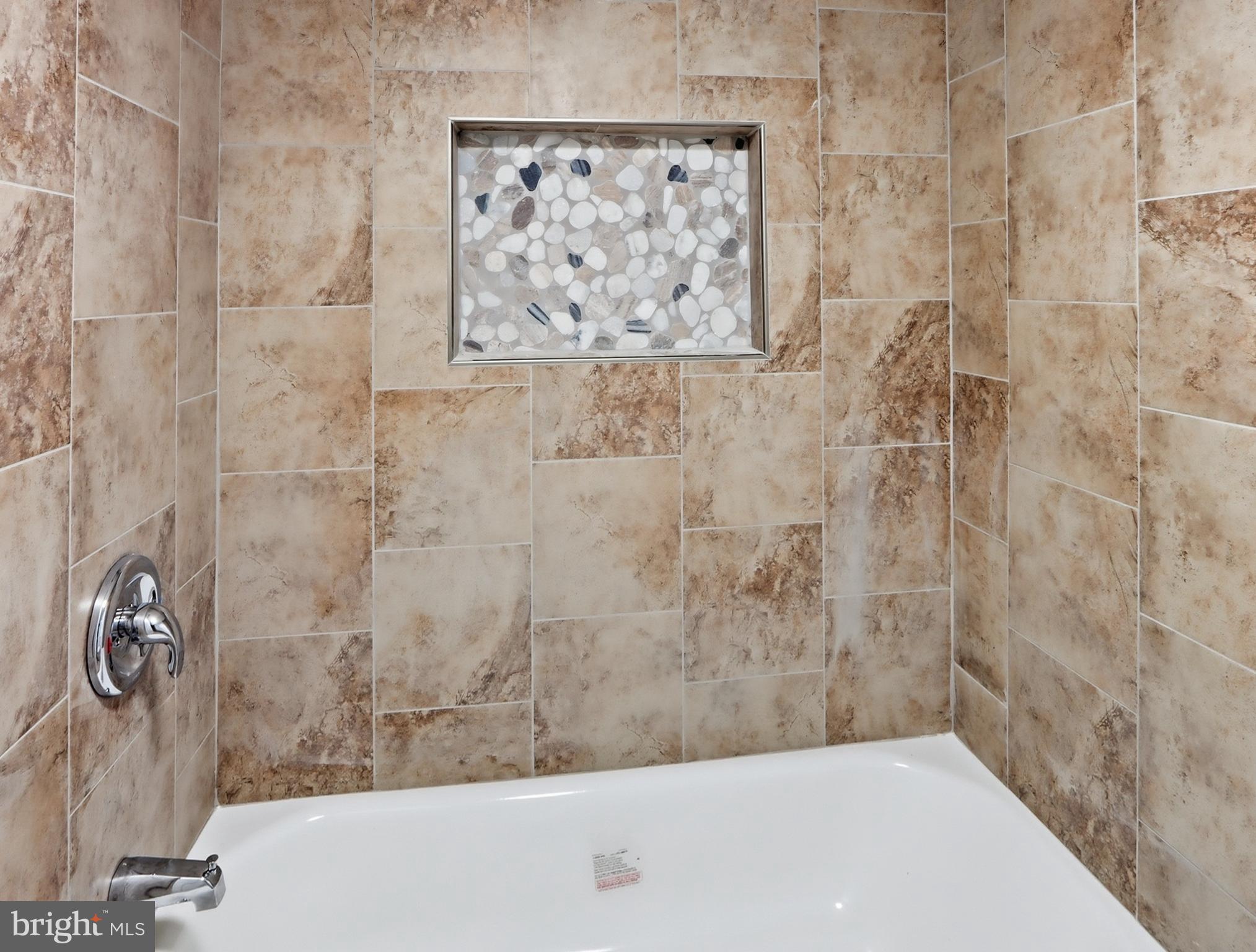 932 East 41st Street Baltimore, MD 21218 - Photo 39 of 51 a bathroom with a bathtub
