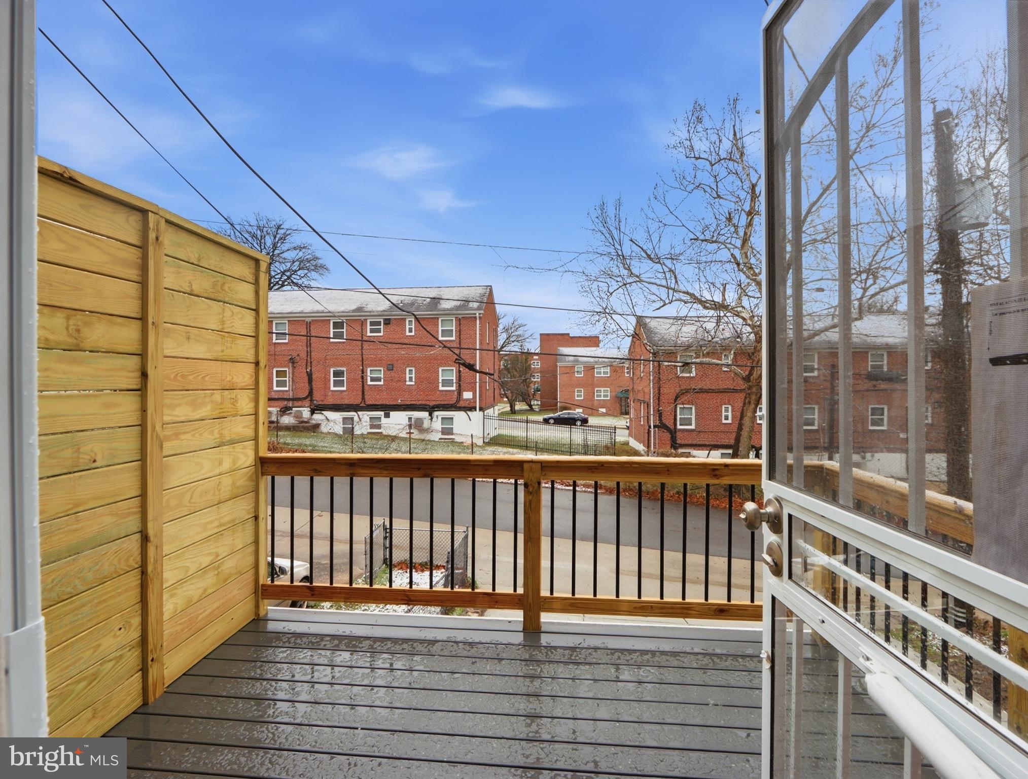 932 East 41st Street Baltimore, MD 21218 - Photo 46 of 51 a view of a balcony with wooden floor