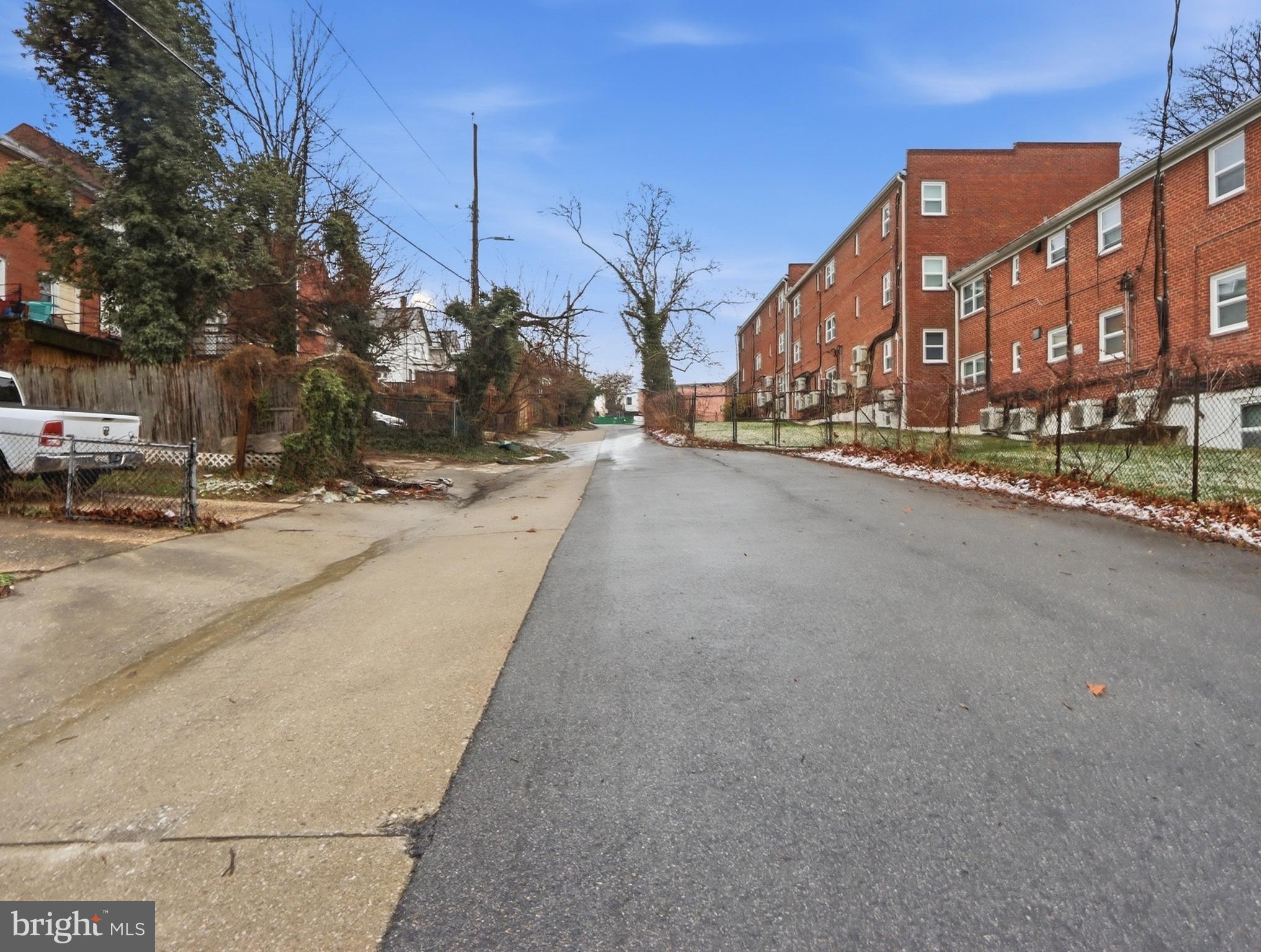 932 East 41st Street Baltimore, MD 21218 - Photo 48 of 51 a view of a street with a building in the background