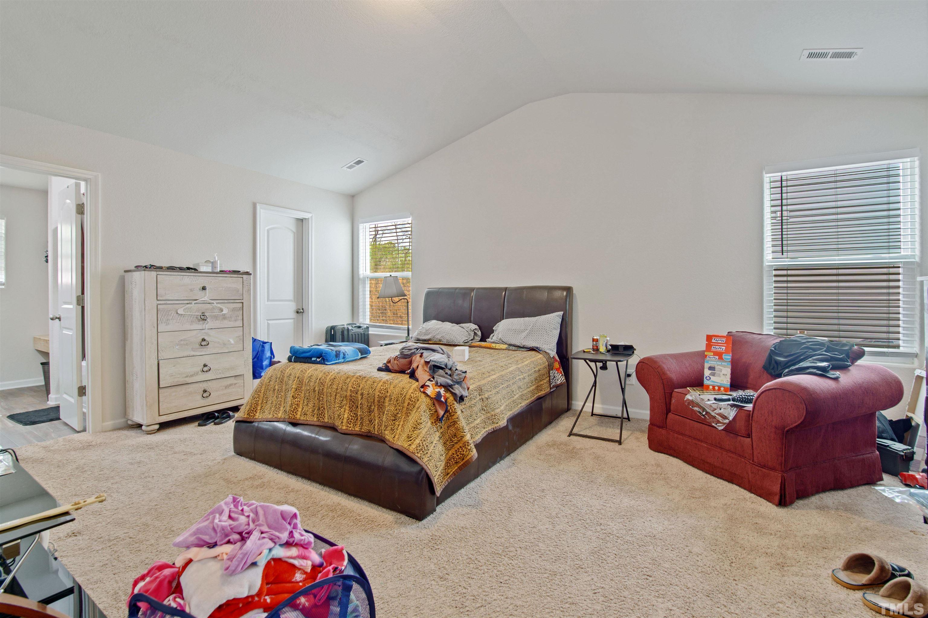 260 Rustling Way Zebulon, NC 27597 - Photo 8 of 14 a bedroom with bed and a couch