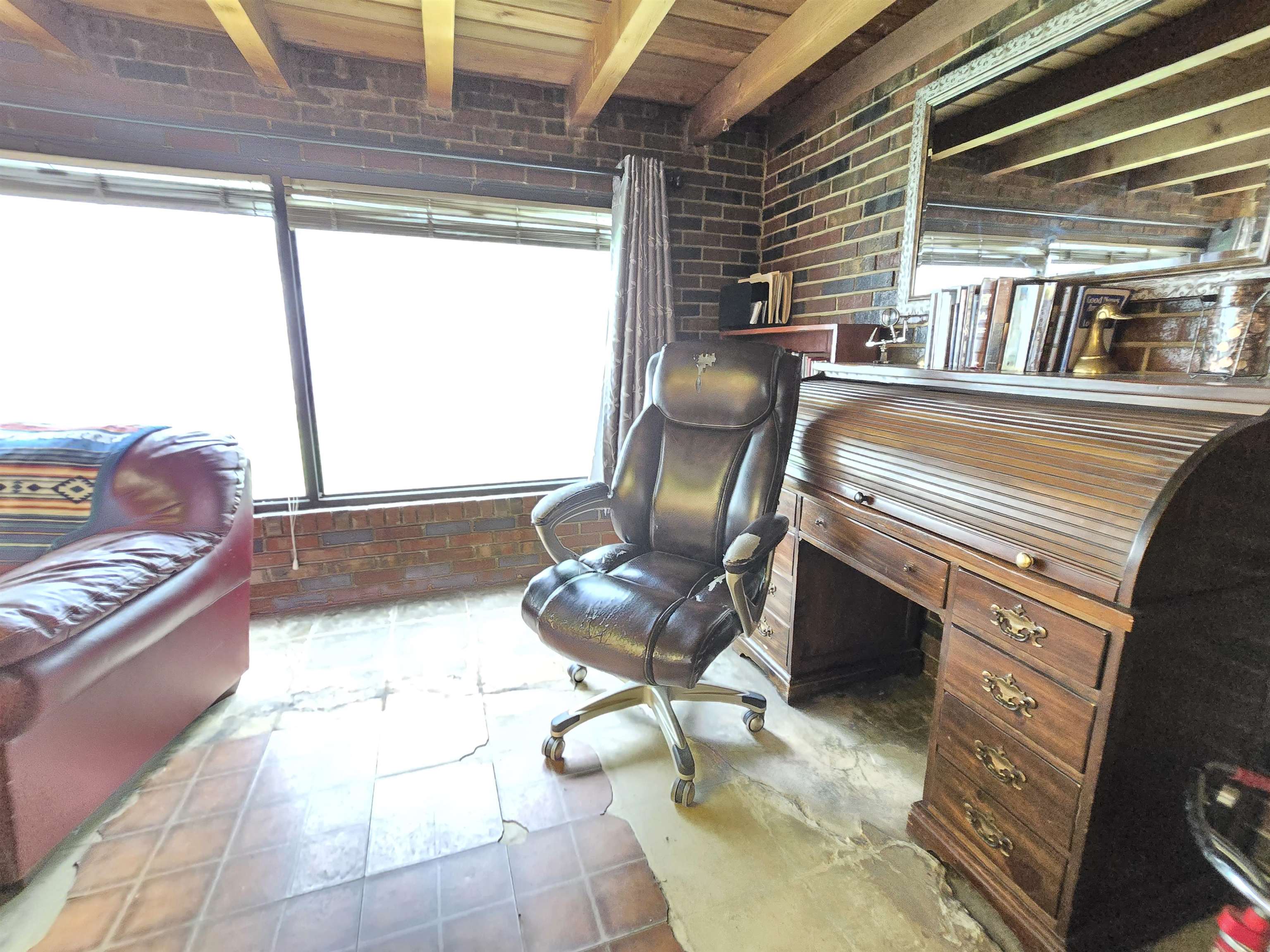 4885 Macon Road Memphis, TN 38122 - Photo 33 of 39 a living room with couches a stove and a dining table with wooden floor