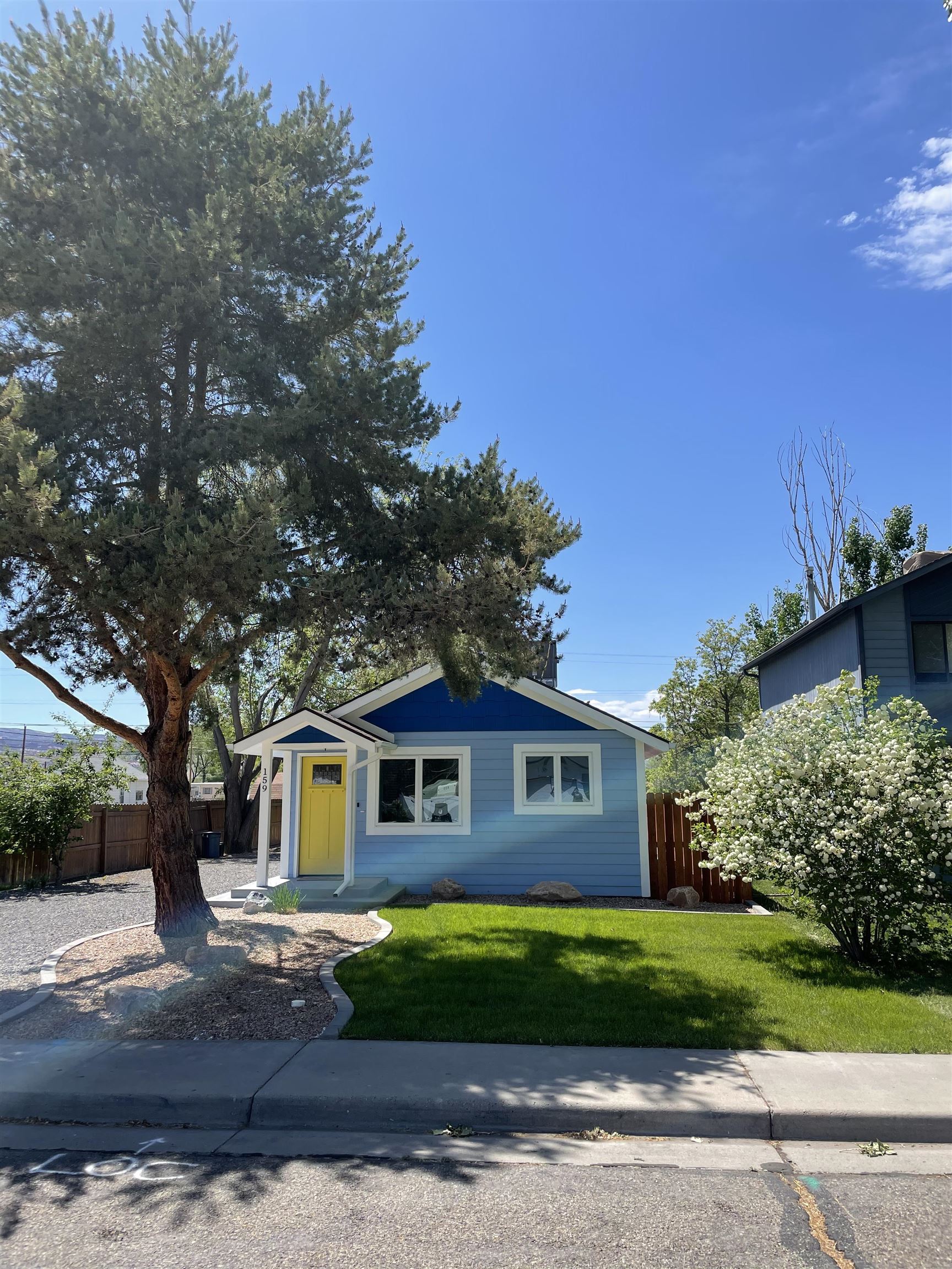 159 North Willow Street Fruita, CO 81521 - Photo 2 of 9 a front view of a house with a garden