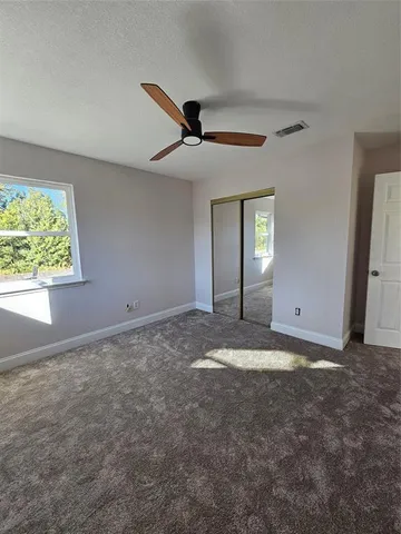 a view of an empty room and window
