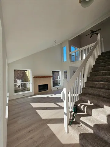 a view of entryway and hall with wooden floor