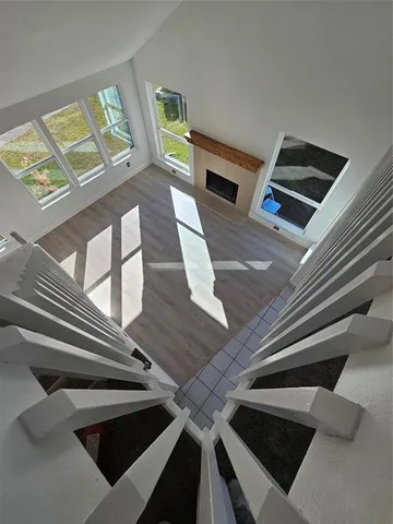 a view of entryway and hall with wooden floor