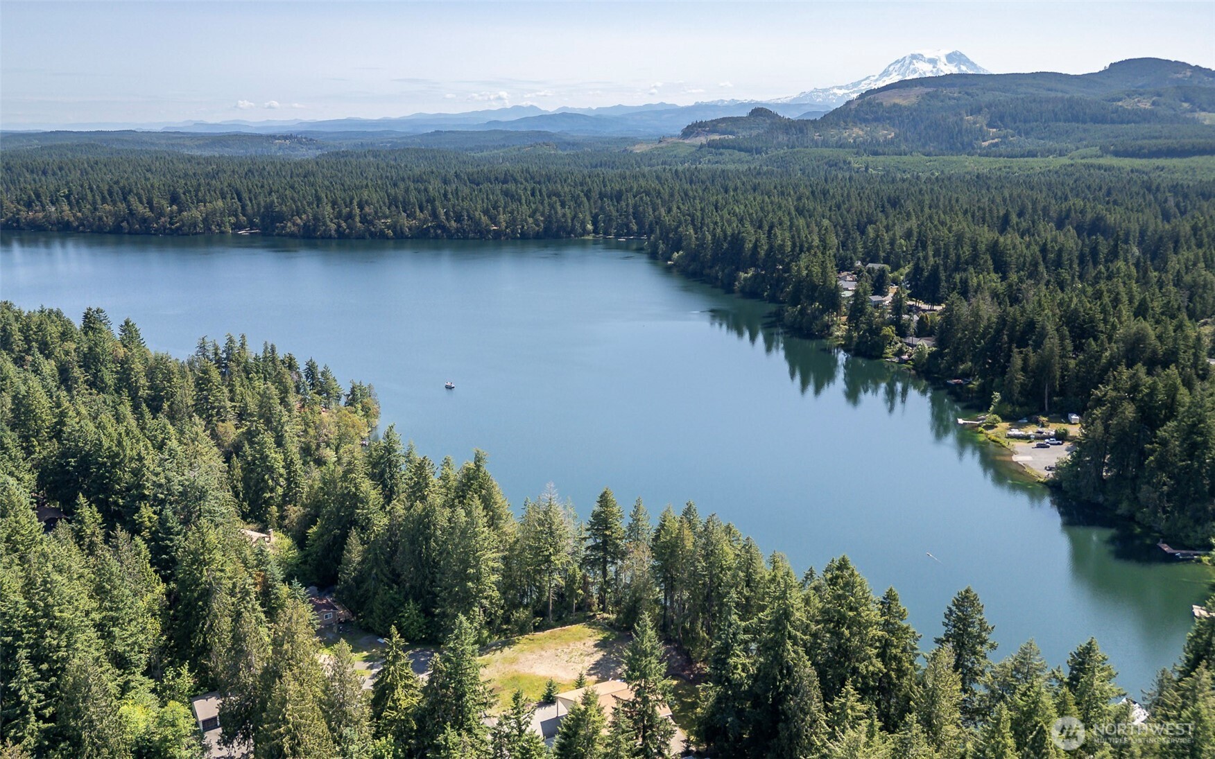 18547 Surcingle Court Southeast Yelm, WA 98597 - Photo 4 of 6 a view of a lake with mountains in the background