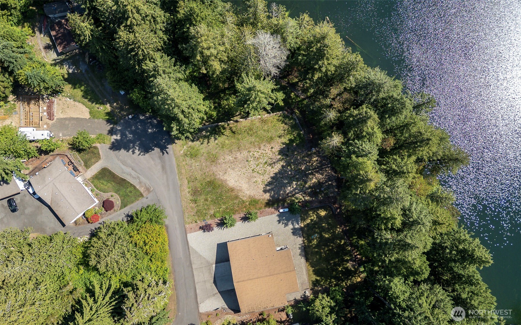 18547 Surcingle Court Southeast Yelm, WA 98597 - Photo 5 of 6 an aerial view of a house with a yard and outdoor seating