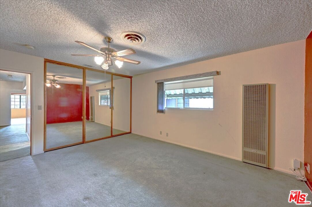 13611 Daventry Street Pacoima, CA 91331 - Photo 19 of 43 a view of an empty room with a window