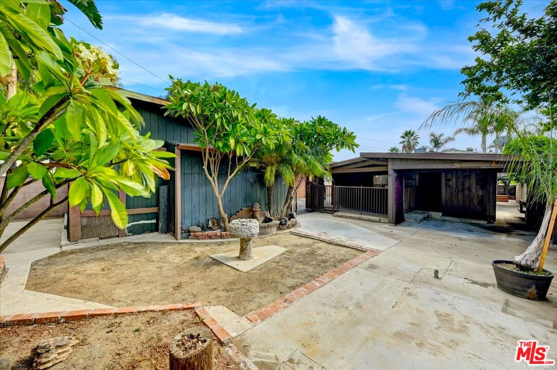 13611 Daventry Street Pacoima, CA 91331 - Photo 37 of 43 a view of a house with backyard and sitting area