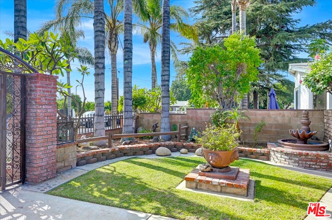 13611 Daventry Street Pacoima, CA 91331 - Photo 39 of 43 a view of a backyard with plants and a patio