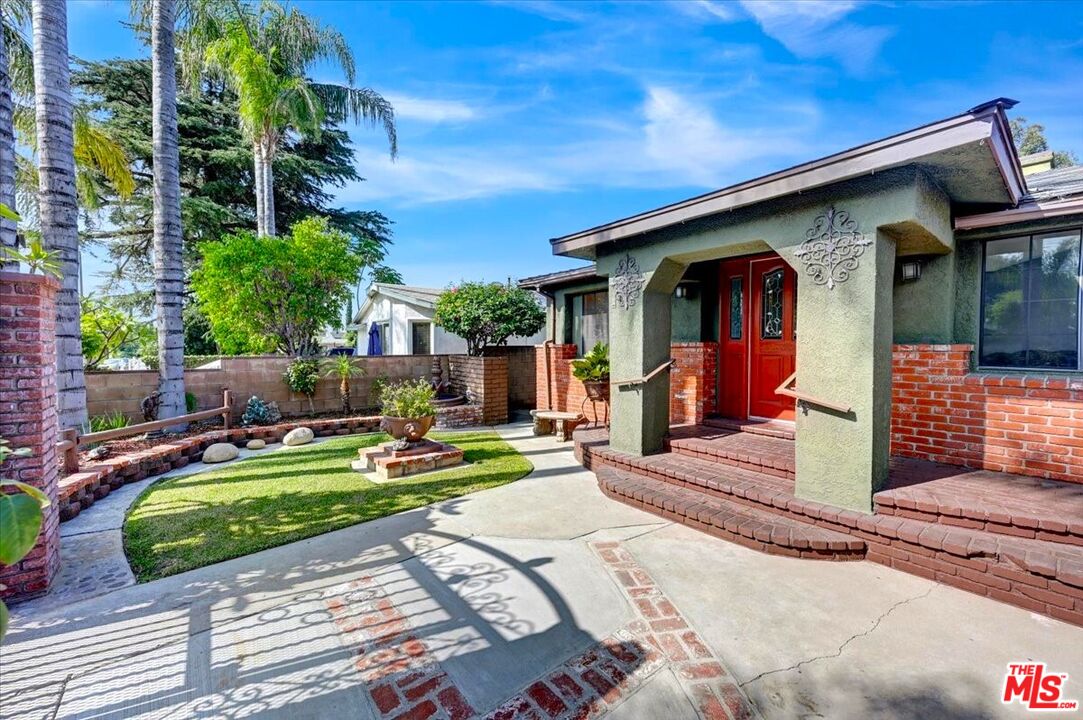 13611 Daventry Street Pacoima, CA 91331 - Photo 5 of 43 a view of a backyard with couches chairs and potted plants