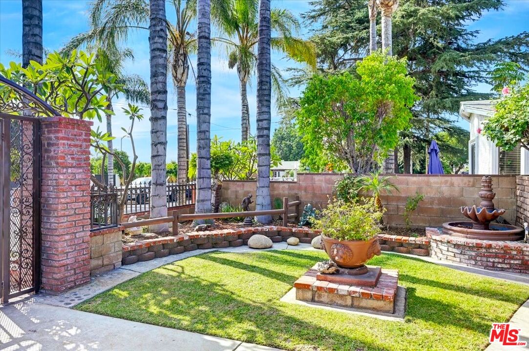 13611 Daventry Street Pacoima, CA 91331 - Photo 6 of 43 a view of a backyard with plants and a patio