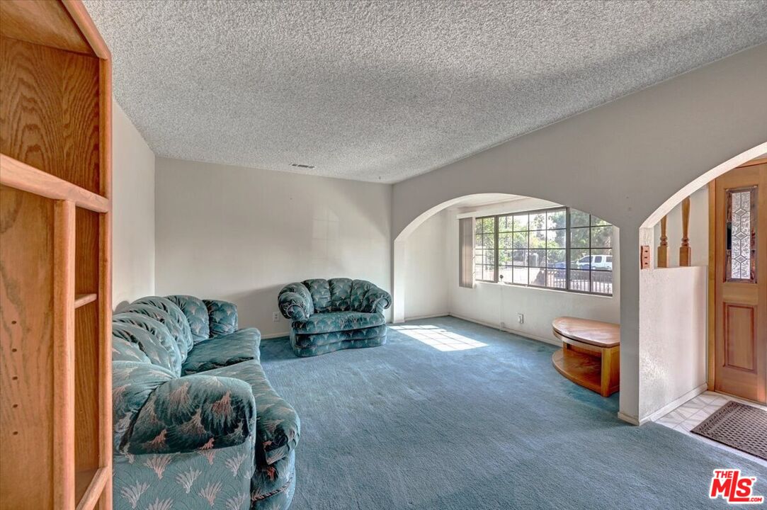 13611 Daventry Street Pacoima, CA 91331 - Photo 7 of 43 a living room with furniture and a large window