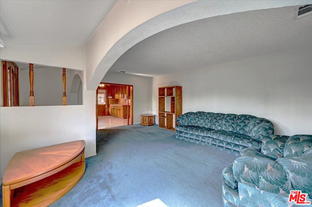 13611 Daventry Street Pacoima, CA 91331 - Photo 8 of 43 a living room with furniture and a couch