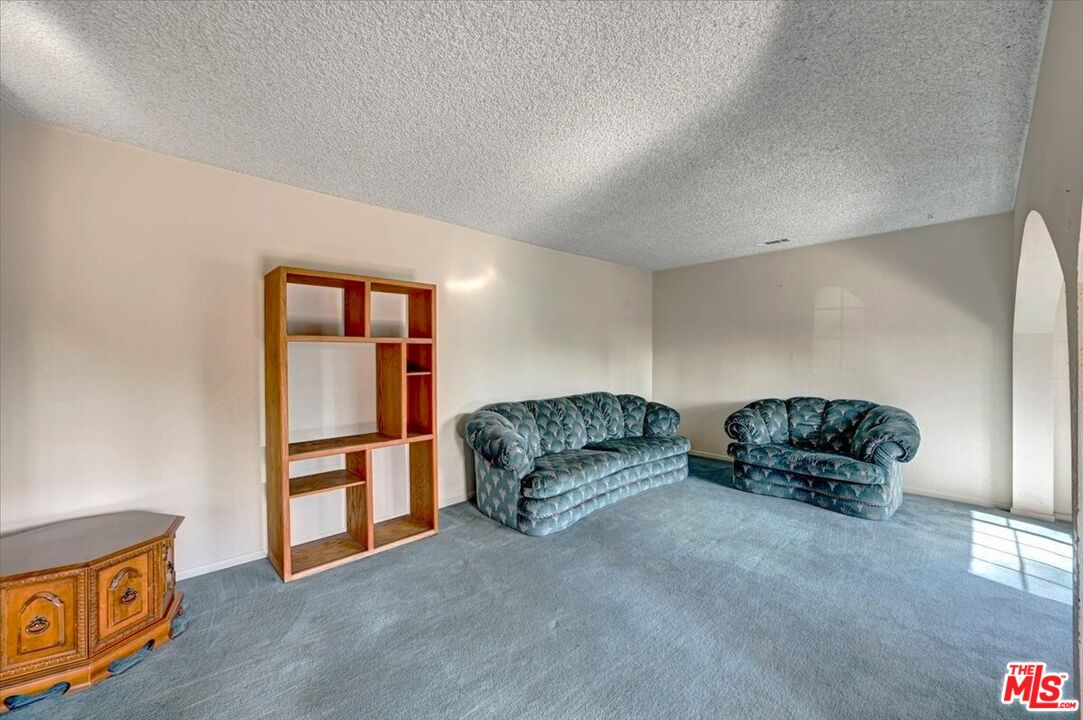 13611 Daventry Street Pacoima, CA 91331 - Photo 9 of 43 a living room with furniture and a window
