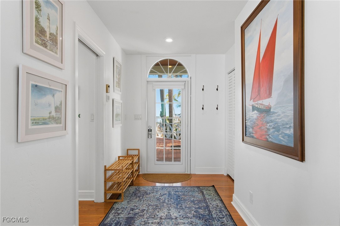 115 Useppa Island Bokeelia, FL 33922 - Photo 12 of 38 a view of an entryway with wooden floor