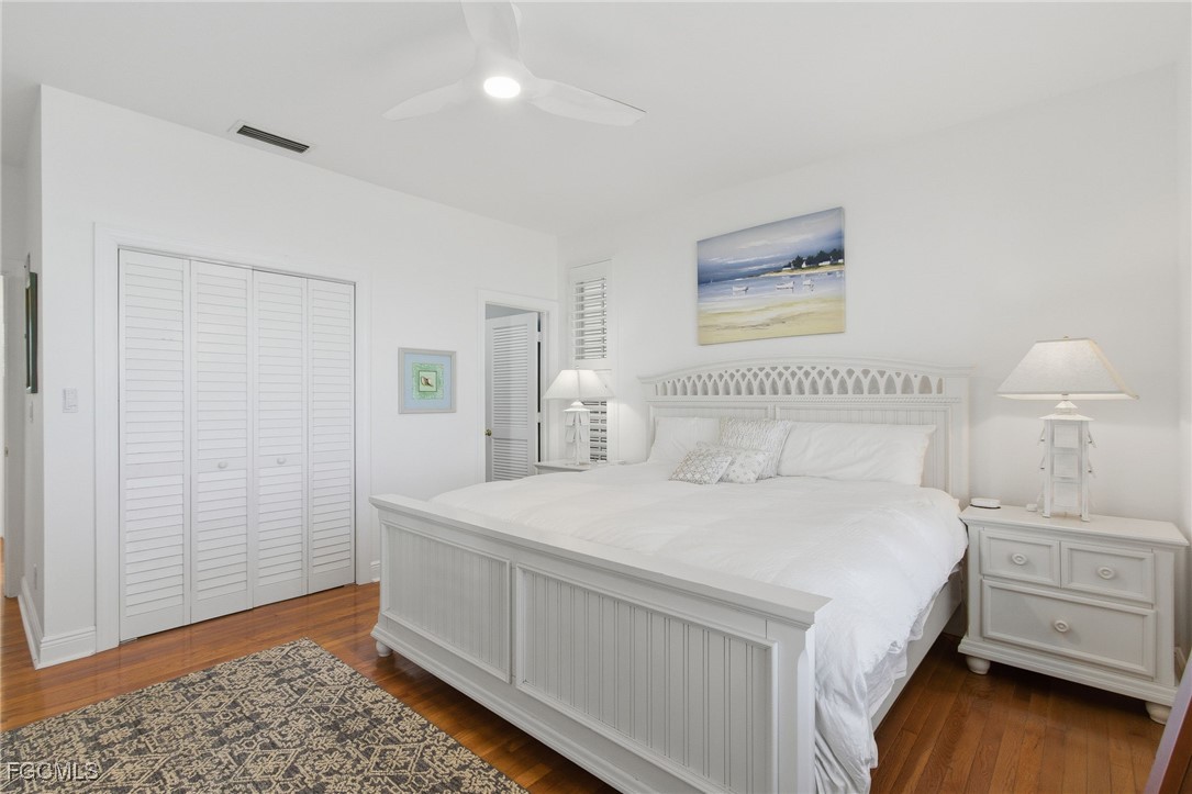 115 Useppa Island Bokeelia, FL 33922 - Photo 20 of 38 a bedroom with a bed and a dresser