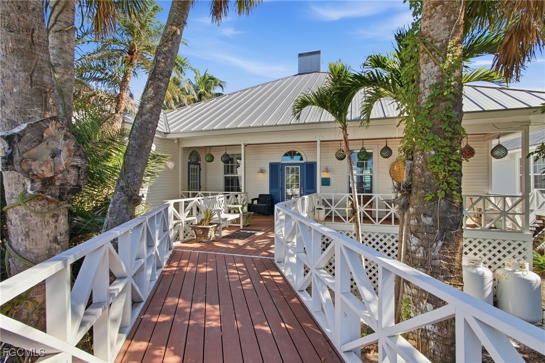 115 Useppa Island Bokeelia, FL 33922 - Photo 2 of 38 a view of a house with wooden deck