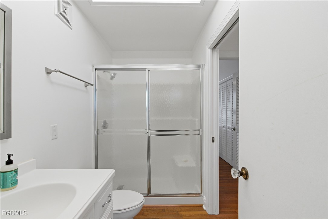 115 Useppa Island Bokeelia, FL 33922 - Photo 22 of 38 a bathroom with a sink toilet and shower