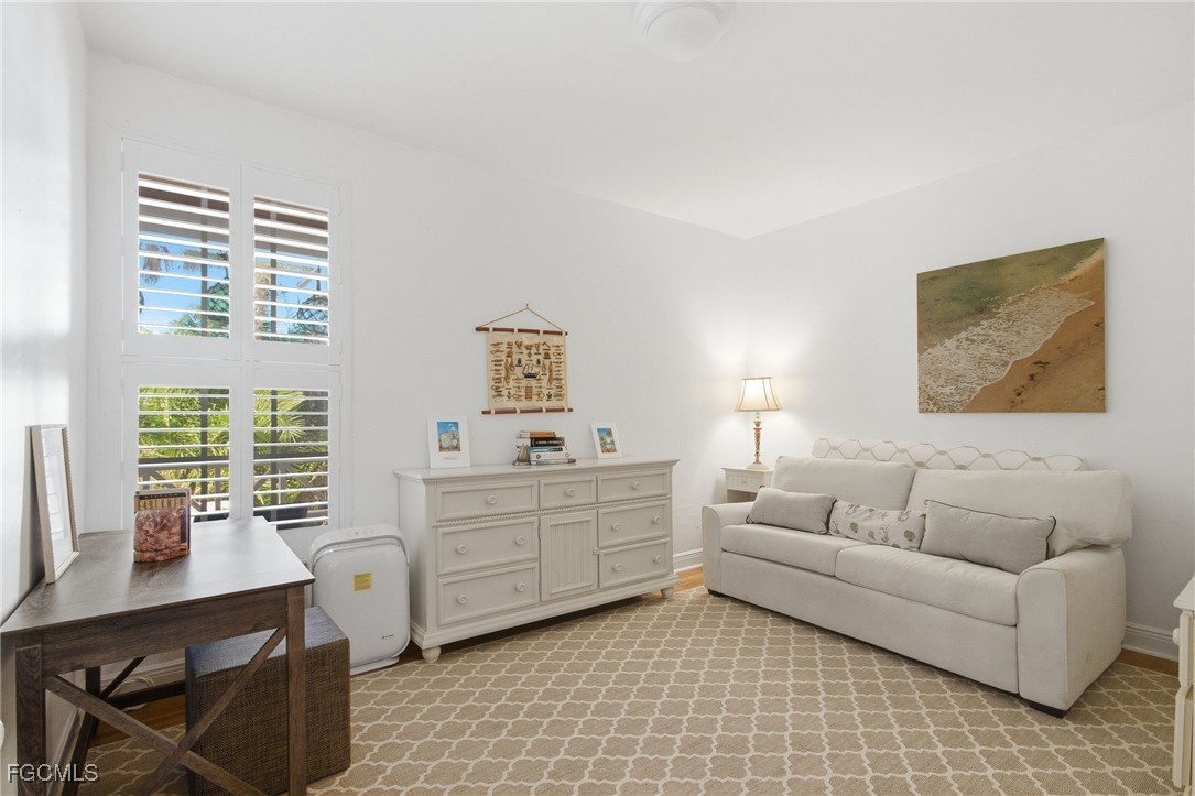 115 Useppa Island Bokeelia, FL 33922 - Photo 24 of 38 a living room with furniture and a window