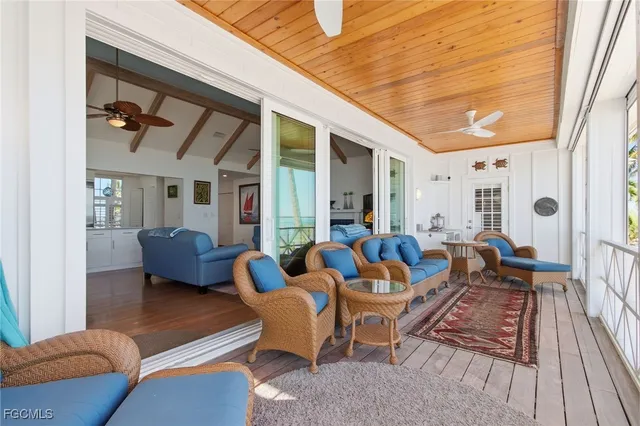 a view of balcony with a potted plant and palm trees