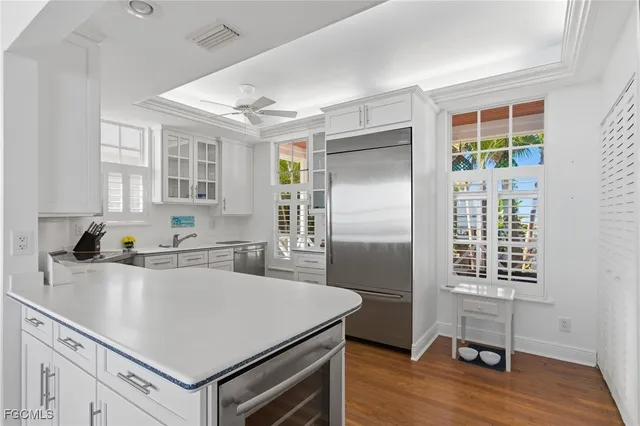 a kitchen with a refrigerator a sink and a stove