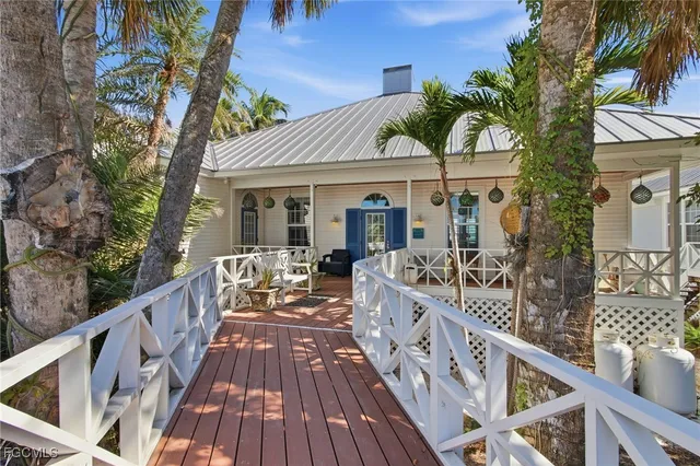 a view of a house with wooden deck