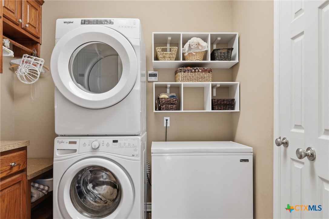 457-459 Buentello Road Victoria, TX 77905 - Photo 14 of 35 a view of a storage & utility room with dryer and washer