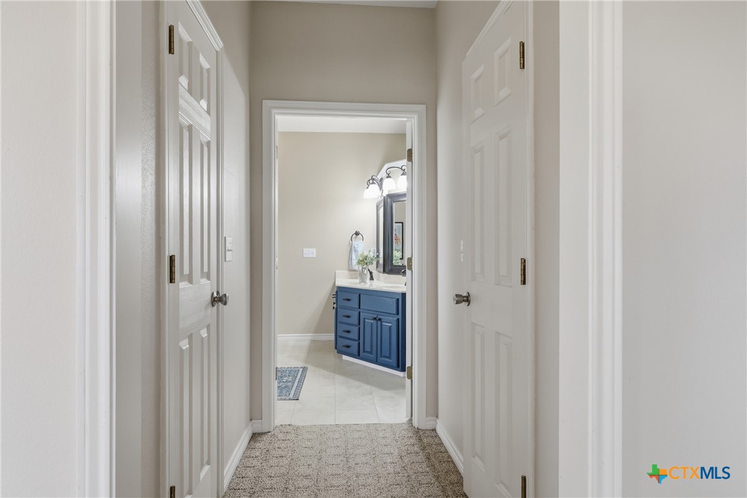 457-459 Buentello Road Victoria, TX 77905 - Photo 19 of 35 a view of a hallway to closet and mirror