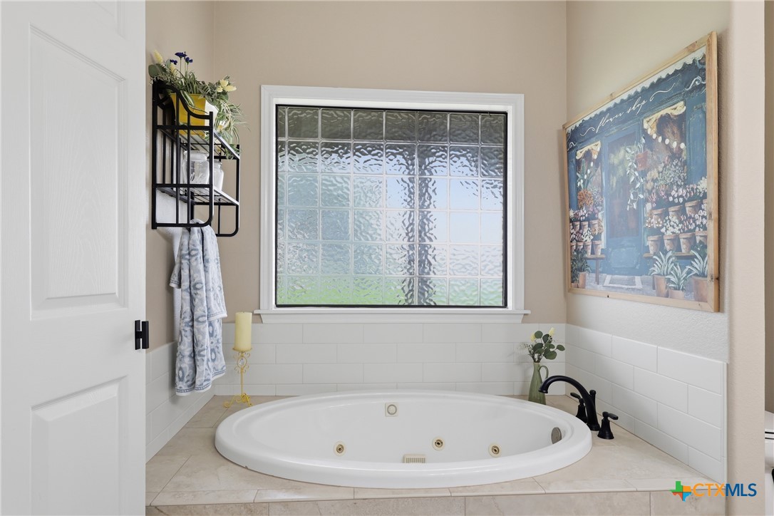 457-459 Buentello Road Victoria, TX 77905 - Photo 21 of 35 a bathroom with a tub and shower