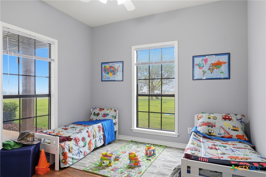 457-459 Buentello Road Victoria, TX 77905 - Photo 24 of 35 a bedroom with baby bed and a window