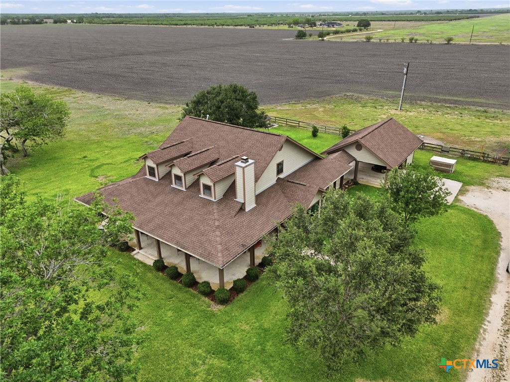 457-459 Buentello Road Victoria, TX 77905 - Photo 34 of 35 an aerial view of a house with a garden and lake view